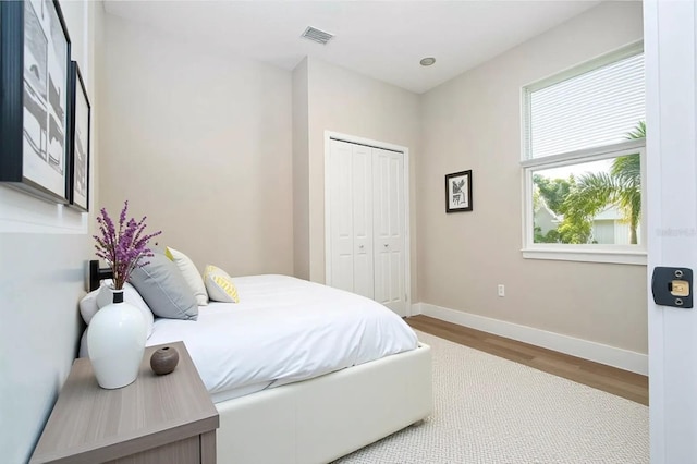 1331 19th St, Orlando, FL 32805 - bedroom with wood finished floors, baseboards, and a closet