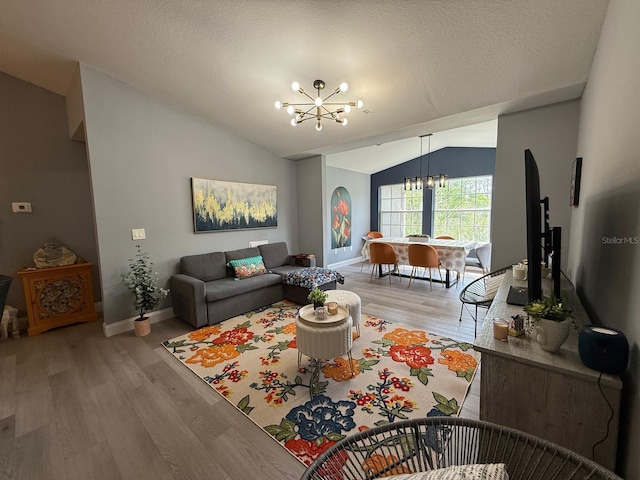 3391 S Kirkman Rd Unit 1236, Orlando, FL 32811 - living area with a chandelier, vaulted ceiling, wood finished floors, and baseboards