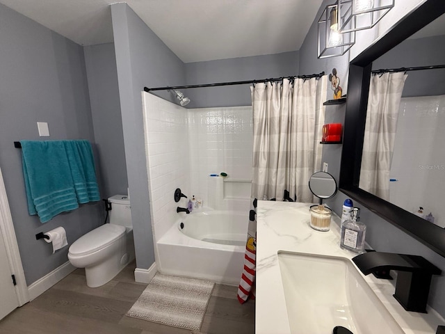 3391 S Kirkman Rd Unit 1236, Orlando, FL 32811 - full bathroom featuring toilet, wood finished floors, shower / tub combo with curtain, vanity, and baseboards