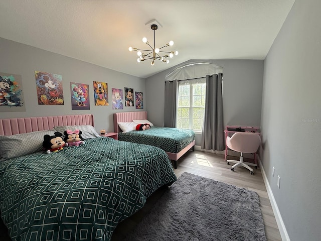 3391 S Kirkman Rd Unit 1236, Orlando, FL 32811 - bedroom featuring a chandelier, wood finished floors, vaulted ceiling, and baseboards
