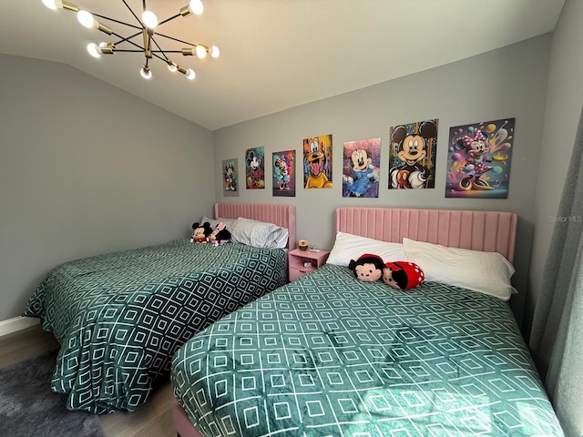 3391 S Kirkman Rd Unit 1236, Orlando, FL 32811 - bedroom featuring wood finished floors, a chandelier, and lofted ceiling