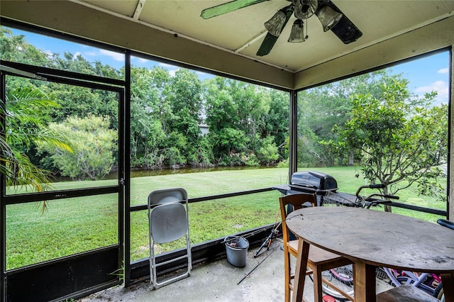 116 Candlewick Ct, Sanford, FL 32771 - sunroom featuring ceiling fan, view of wooded area, and outdoor dining area