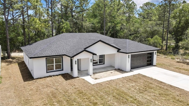 3461 W Webster Pl, Citrus Springs, FL 34433 - ranch-style home featuring a garage, driveway, stucco siding, and a shingled roof