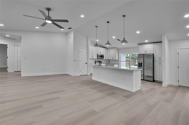 3461 W Webster Pl, Citrus Springs, FL 34433 - kitchen featuring appliances with stainless steel finishes, light countertops, baseboards, recessed lighting, and white cabinets
