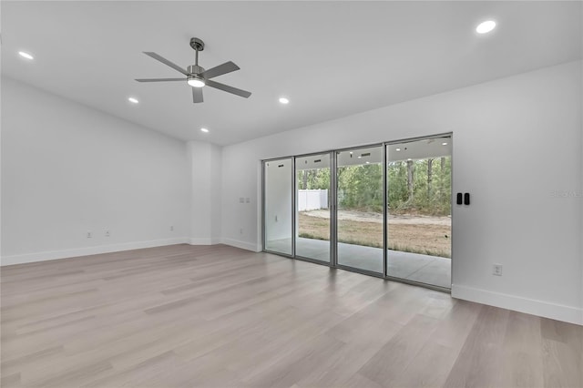 3461 W Webster Pl, Citrus Springs, FL 34433 - unfurnished room with a ceiling fan, light wood finished floors, recessed lighting, and baseboards