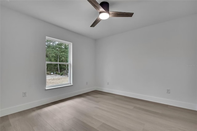 3461 W Webster Pl, Citrus Springs, FL 34433 - unfurnished room with ceiling fan, wood finished floors, and baseboards