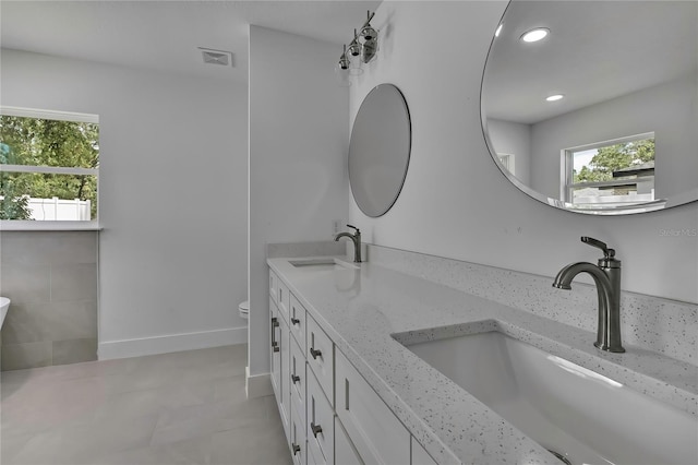 3461 W Webster Pl, Citrus Springs, FL 34433 - bathroom with double vanity, toilet, recessed lighting, and tile patterned flooring