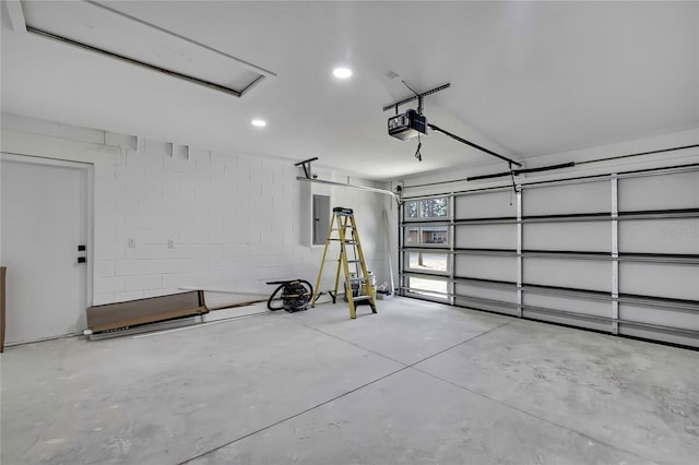 3461 W Webster Pl, Citrus Springs, FL 34433 - garage featuring a garage door opener, electric panel, and concrete block wall