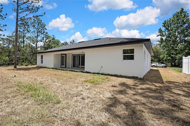 3461 W Webster Pl, Citrus Springs, FL 34433 - rear view of house with stucco siding