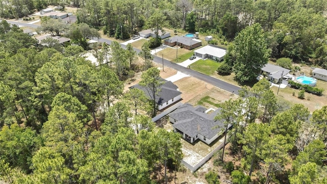 3461 W Webster Pl, Citrus Springs, FL 34433 - aerial overview of property's location featuring a forest and nearby suburban area