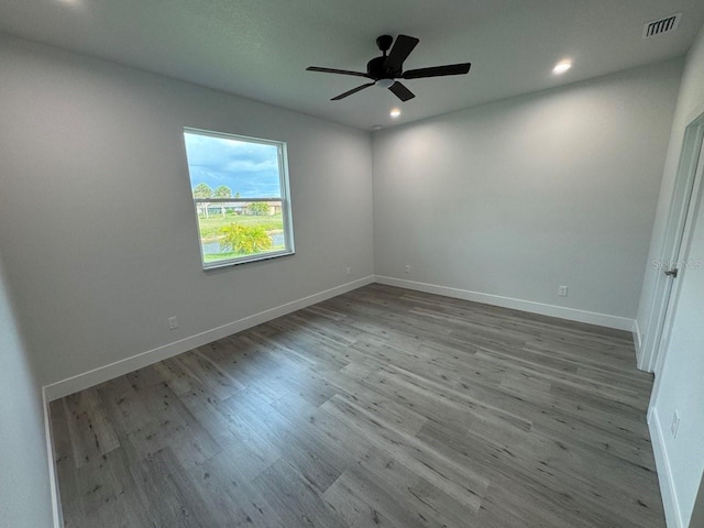 9 Bunker Pl, Rotonda West, FL 33947 - empty room featuring wood finished floors, baseboards, recessed lighting, and a ceiling fan