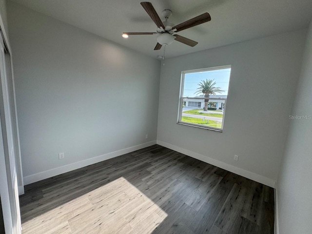 9 Bunker Pl, Rotonda West, FL 33947 - empty room featuring wood finished floors, baseboards, and a ceiling fan