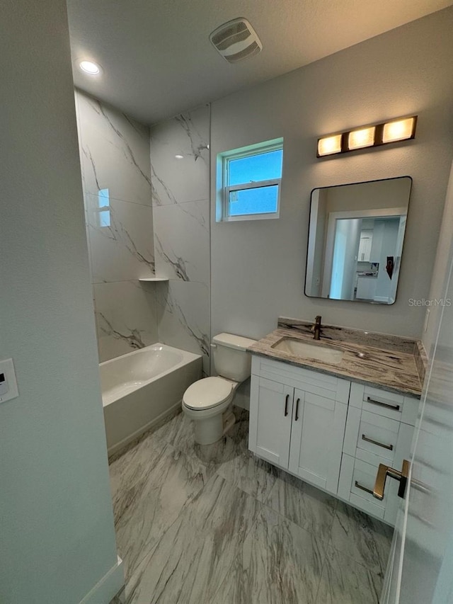 9 Bunker Pl, Rotonda West, FL 33947 - full bathroom with vanity, toilet, marble look tiles, washtub / shower combination, and baseboards