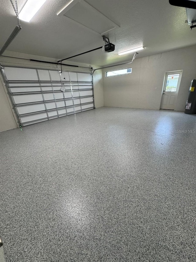 9 Bunker Pl, Rotonda West, FL 33947 - garage featuring a garage door opener and water heater