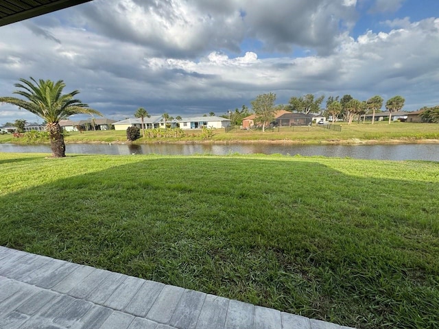 9 Bunker Pl, Rotonda West, FL 33947 - view of grassy yard featuring a water view and a residential view