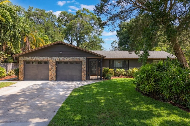 1343 Charlotte St, Altamonte Springs, FL 32701 - ranch-style home featuring concrete driveway, an attached garage, a front lawn, and stone siding