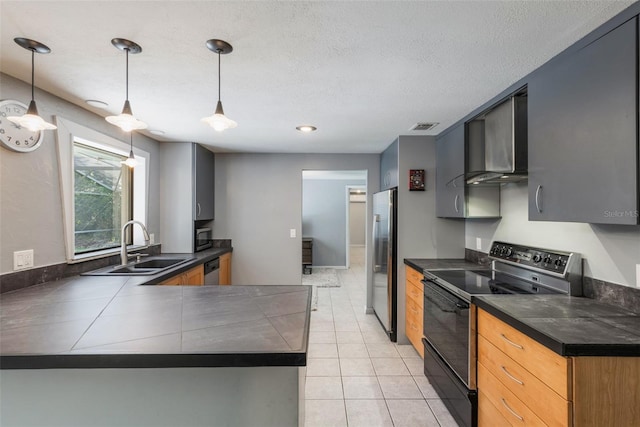 1343 Charlotte St, Altamonte Springs, FL 32701 - kitchen with stainless steel appliances, dark countertops, wall chimney range hood, a peninsula, and a sink