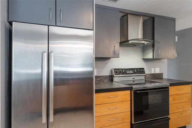 1343 Charlotte St, Altamonte Springs, FL 32701 - kitchen featuring electric range oven, wall chimney range hood, stainless steel refrigerator, and dark countertops