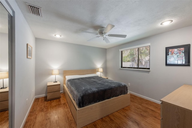 1343 Charlotte St, Altamonte Springs, FL 32701 - bedroom with wood finished floors, baseboards, a textured ceiling, and a ceiling fan