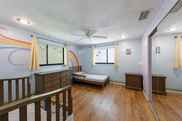 1343 Charlotte St, Altamonte Springs, FL 32701 - bedroom with wood finished floors, baseboards, and a textured ceiling