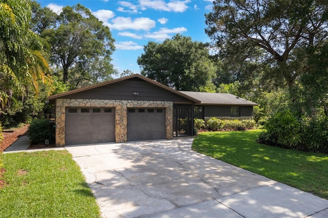 1343 Charlotte St, Altamonte Springs, FL 32701 - ranch-style home featuring a garage, stone siding, concrete driveway, and a front yard