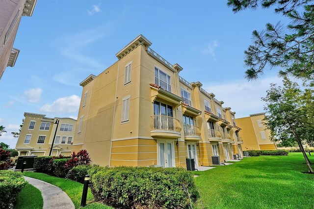 4816 Tidecrest Ave Unit 178, Orlando, FL 32819 - view of building exterior featuring central air condition unit