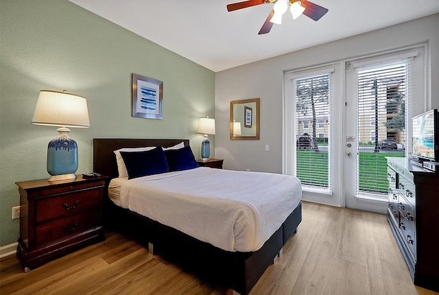 4816 Tidecrest Ave Unit 178, Orlando, FL 32819 - bedroom featuring access to outside, light wood finished floors, french doors, and a ceiling fan