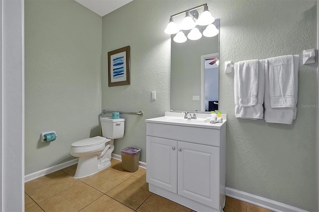4816 Tidecrest Ave Unit 178, Orlando, FL 32819 - bathroom with toilet, tile patterned flooring, vanity, baseboards, and a textured wall