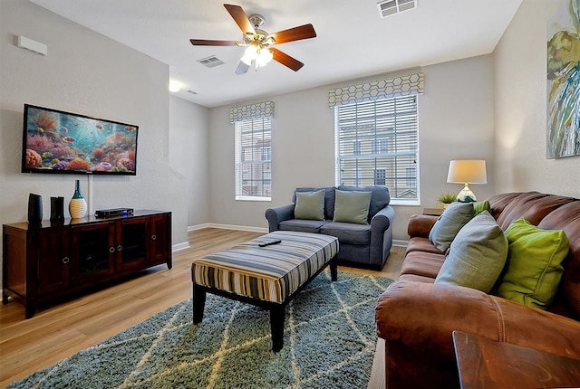 4816 Tidecrest Ave Unit 178, Orlando, FL 32819 - living area featuring light wood-style flooring, ceiling fan, and baseboards