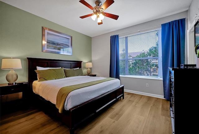 4816 Tidecrest Ave Unit 178, Orlando, FL 32819 - bedroom featuring wood finished floors, baseboards, and a ceiling fan