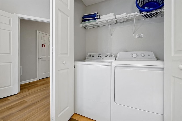 4816 Tidecrest Ave Unit 178, Orlando, FL 32819 - laundry area with washer and dryer and light wood-type flooring