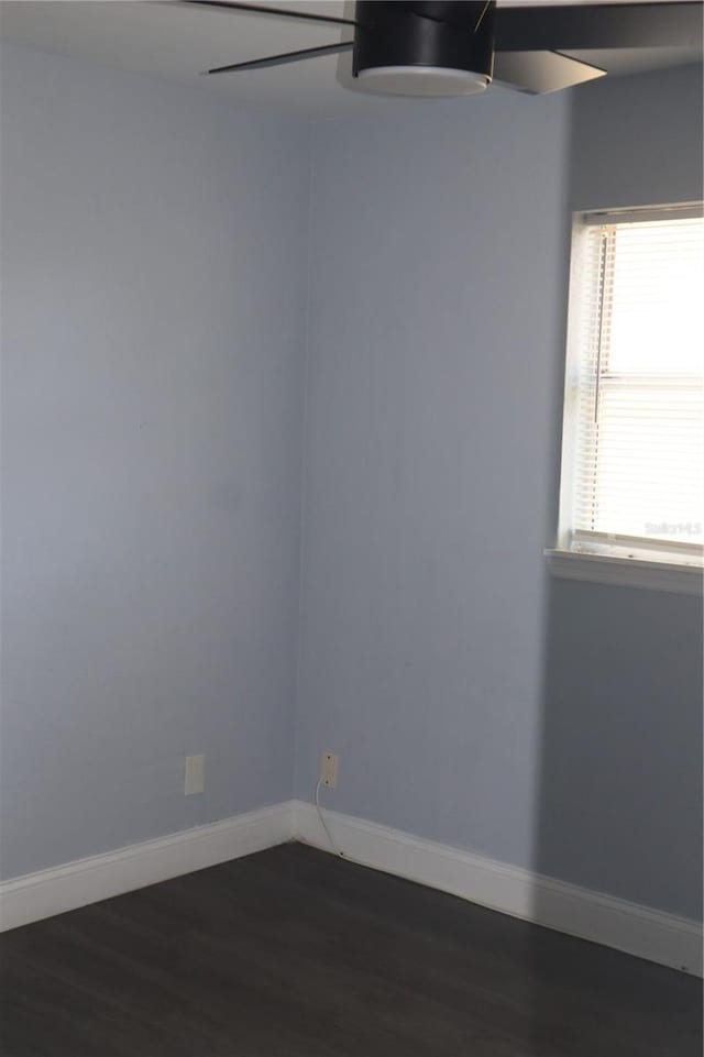 1212 Leon Ln, Daytona Beach, FL 32117 - spare room with dark wood-style floors, baseboards, and ceiling fan
