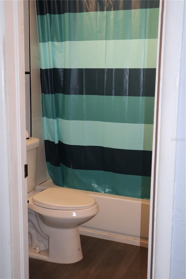 1212 Leon Ln, Daytona Beach, FL 32117 - full bath featuring toilet, wood finished floors, and shower / bath combo