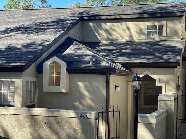 1486 Farrindon Cir, Lake Mary, FL 32746 - view of front of property with roof with shingles and stucco siding