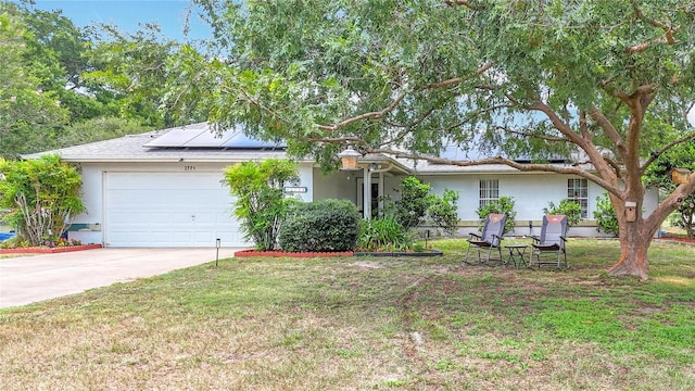 2771 NE 66th St, Ocala, FL 34479 - ranch-style home featuring a garage, stucco siding, driveway, solar panels, and a front yard