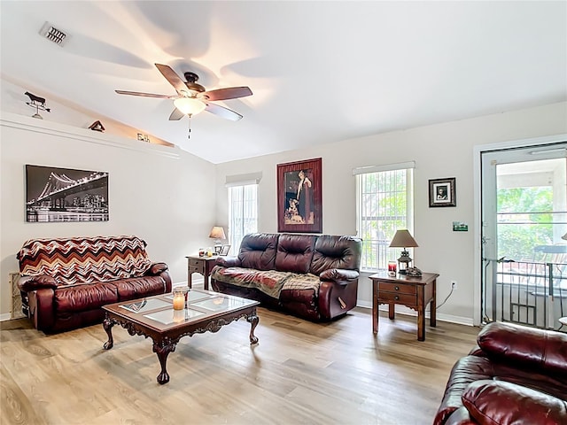 2771 NE 66th St, Ocala, FL 34479 - living area featuring vaulted ceiling, a ceiling fan, light wood-style floors, and baseboards