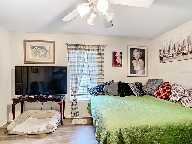 2771 NE 66th St, Ocala, FL 34479 - bedroom featuring wood finished floors, a ceiling fan, and baseboards