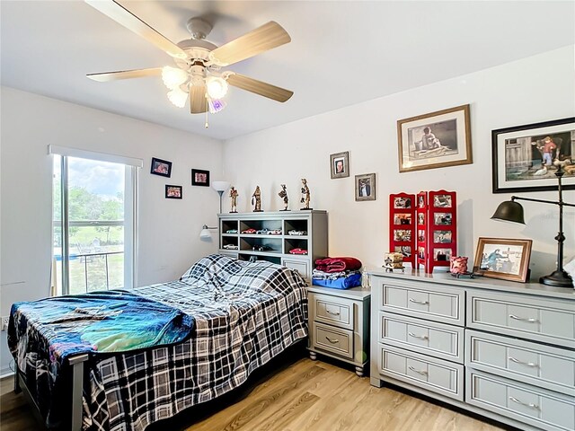 2771 NE 66th St, Ocala, FL 34479 - bedroom with light wood-style flooring and ceiling fan