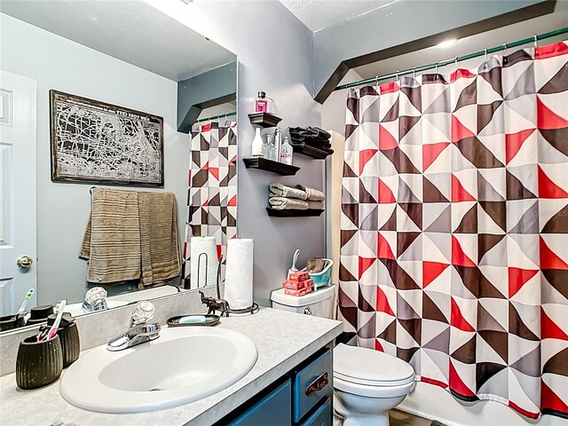 2771 NE 66th St, Ocala, FL 34479 - bathroom featuring vanity, toilet, and a shower with curtain