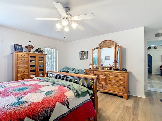 2771 NE 66th St, Ocala, FL 34479 - bedroom with light wood-type flooring, ceiling fan, and baseboards