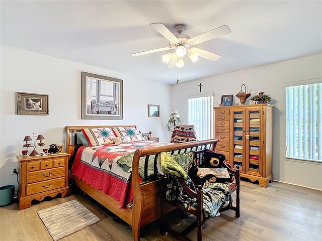 2771 NE 66th St, Ocala, FL 34479 - bedroom featuring multiple windows, light wood-style flooring, and a ceiling fan