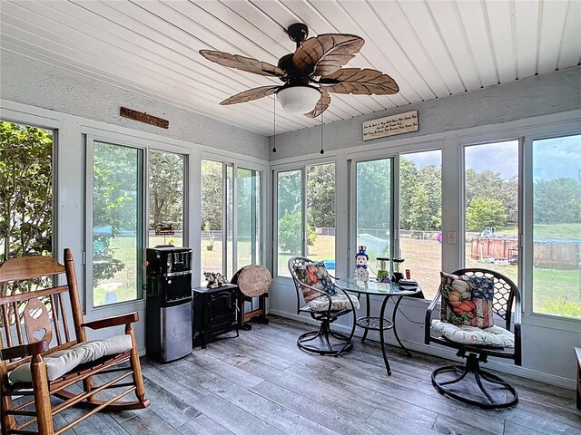 2771 NE 66th St, Ocala, FL 34479 - sunroom / solarium featuring a ceiling fan, wooden ceiling, hardwood / wood-style floors, and a wooden deck