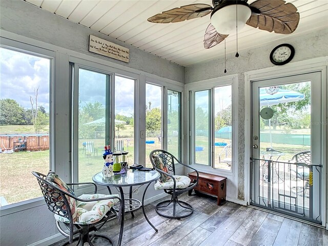 2771 NE 66th St, Ocala, FL 34479 - sunroom / solarium featuring hardwood / wood-style floors, ceiling fan, and wooden ceiling