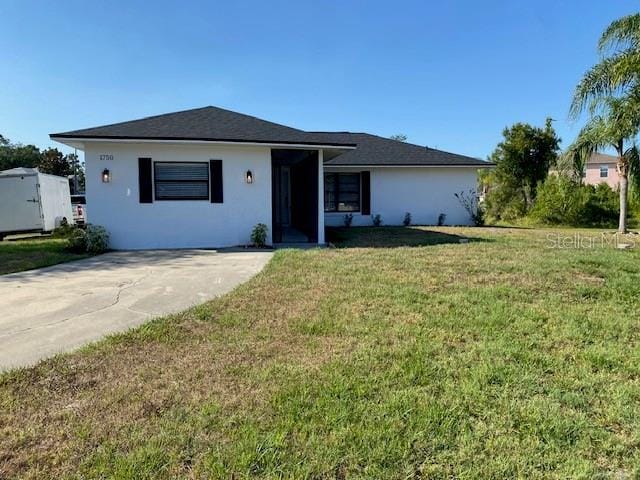 1750 Mitten Ter, Deltona, FL 32738 - view of front of house featuring stucco siding and a front lawn