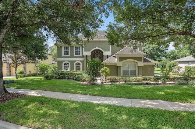 490 Wekiva Preserve Dr, Apopka, FL 32712 - view of front of house with stucco siding, a front lawn, a chimney, and roof with shingles