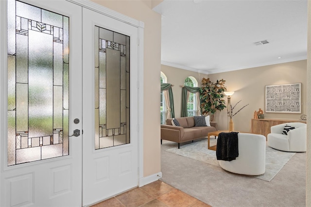 490 Wekiva Preserve Dr, Apopka, FL 32712 - entrance foyer with carpet floors, ornamental molding, tile patterned flooring, and baseboards