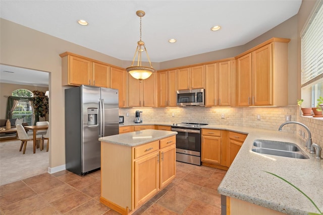 490 Wekiva Preserve Dr, Apopka, FL 32712 - kitchen with stainless steel appliances, a sink, light brown cabinetry, light stone countertops, and recessed lighting
