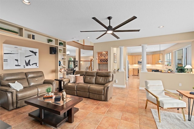 490 Wekiva Preserve Dr, Apopka, FL 32712 - living room featuring ornate columns, ceiling fan, recessed lighting, a textured ceiling, and light tile patterned flooring