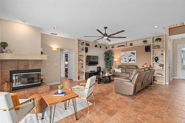 490 Wekiva Preserve Dr, Apopka, FL 32712 - living room with ceiling fan, a tiled fireplace, baseboards, recessed lighting, and built in features