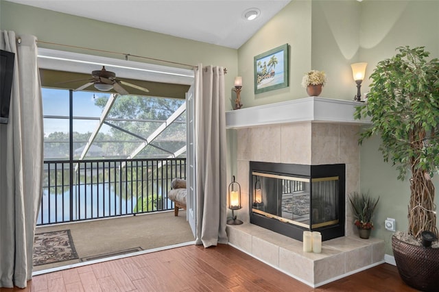 490 Wekiva Preserve Dr, Apopka, FL 32712 - living room with a water view, ceiling fan, wood finished floors, and a tiled fireplace